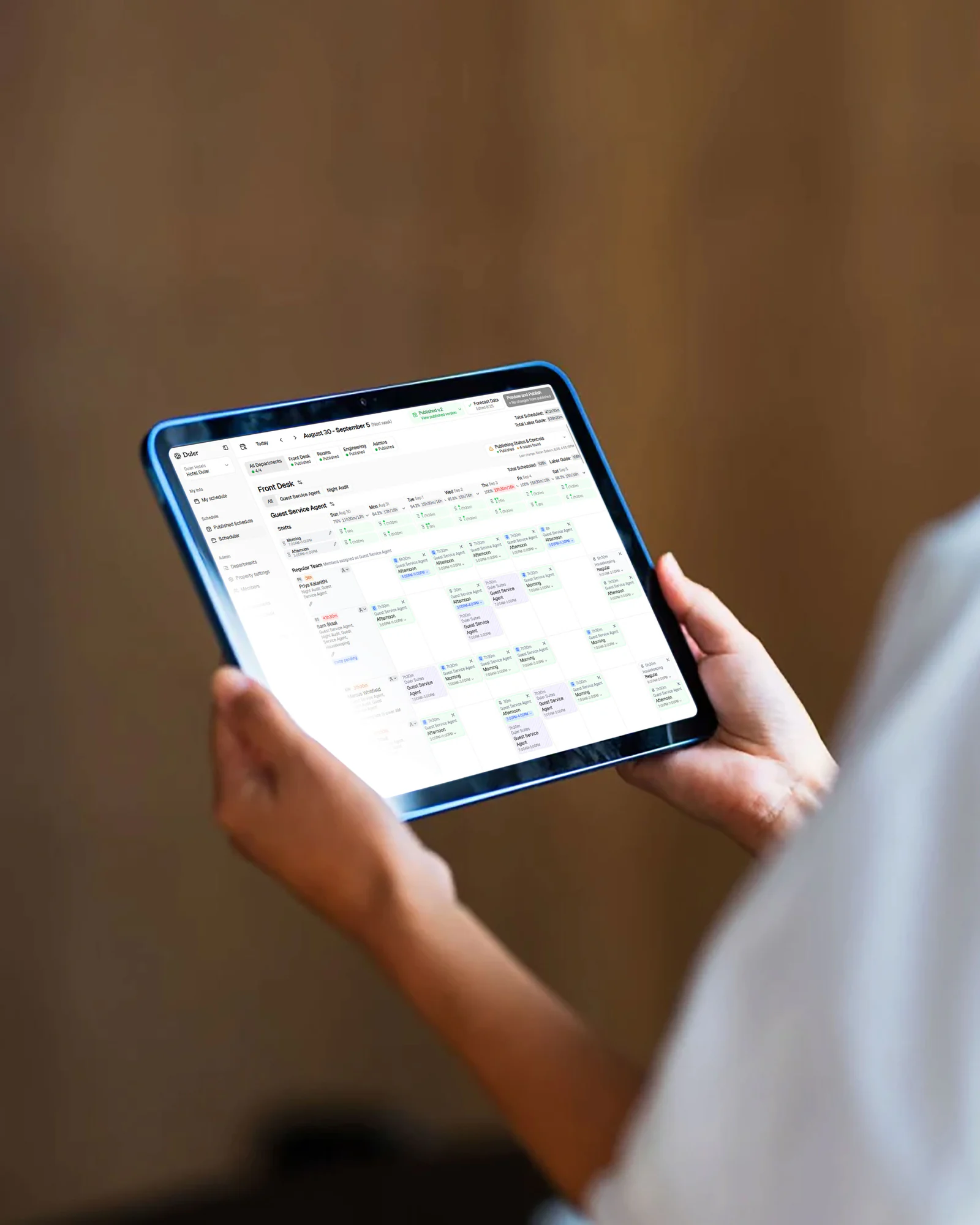 Hotel manager reviewing the Duler schedule on a tablet